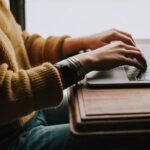 Person using a laptop; illustrative photograph, not a person accused of fraud