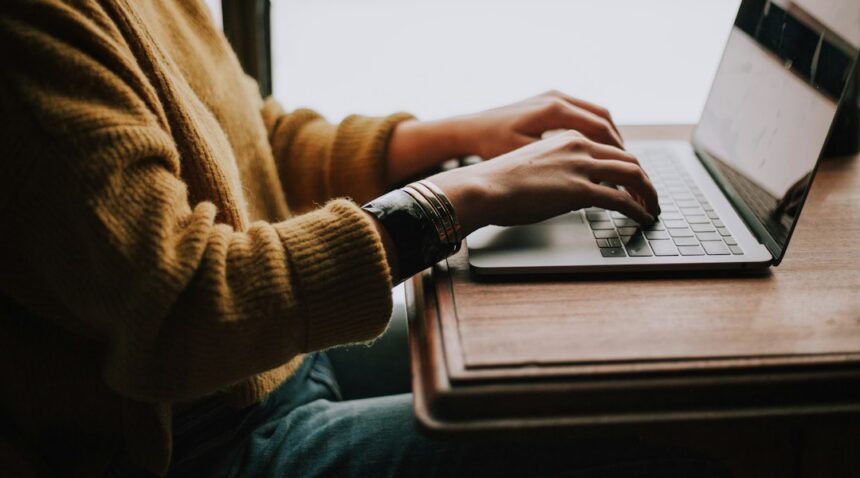 Person using a laptop; illustrative photograph, not a person accused of fraud