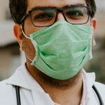 Physician wearing medical scrubs and a stethoscope