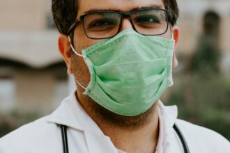 Physician wearing medical scrubs and a stethoscope