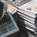 Stack of newspapers representing Christian media
