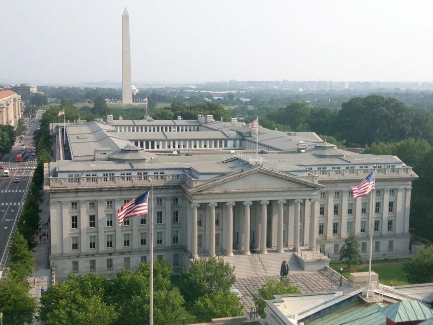U.S. Treasury building in Washington, D.C., with the Washington Monument in the background, photographed in July 2015.