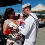 USS Abraham Lincoln sailor greets family in San Diego on August 11, 2022. File photo, not the October 2026 homecoming.