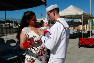 USS Abraham Lincoln sailor greets family in San Diego on August 11, 2022. File photo, not the October 2026 homecoming.