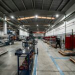 Workers and equipment inside a manufacturing facility
