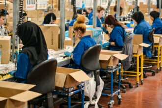 Workers on an industrial assembly line